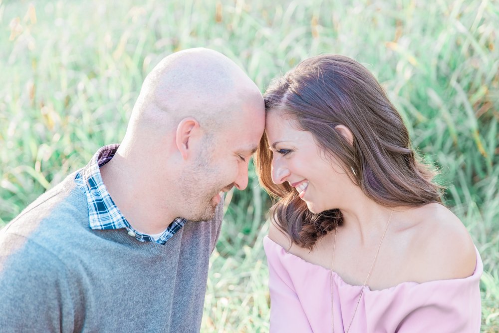 Engagement photos in a field of wheat in Raleigh