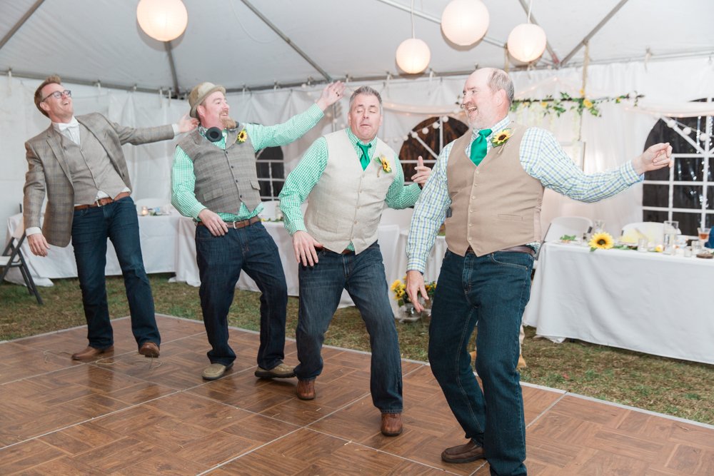 Groomsmen dancing at wedding