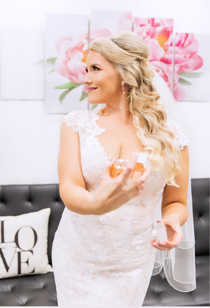 Bride holding Coco Chanel San Jose wedding photographer Leah Marie Photography + Stationery